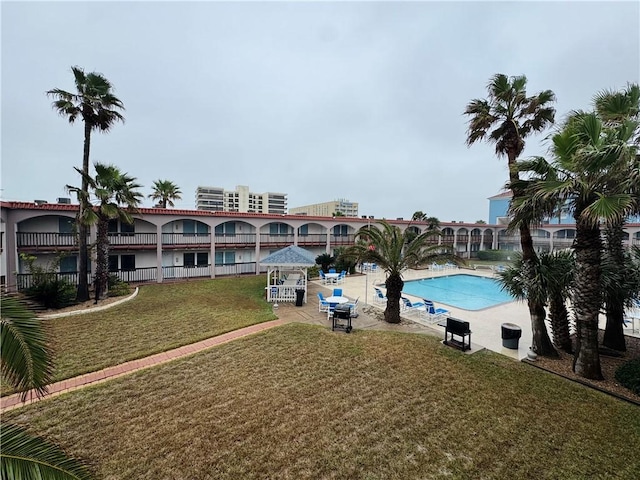 view of pool featuring a gazebo and a lawn