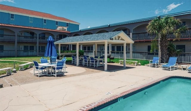 view of swimming pool featuring a patio area