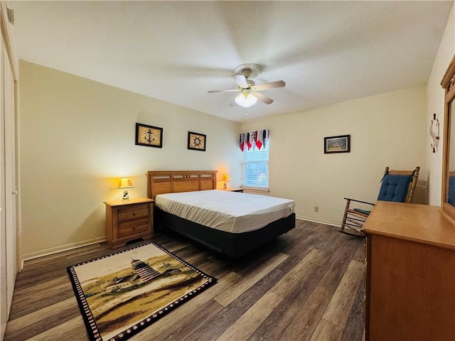 bedroom with ceiling fan and dark wood-type flooring