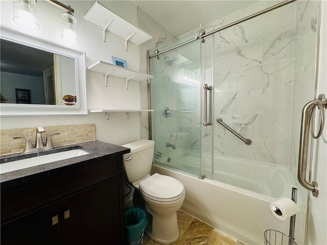 full bathroom with vanity, toilet, and enclosed tub / shower combo