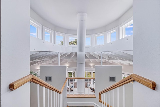 stairway featuring a wealth of natural light