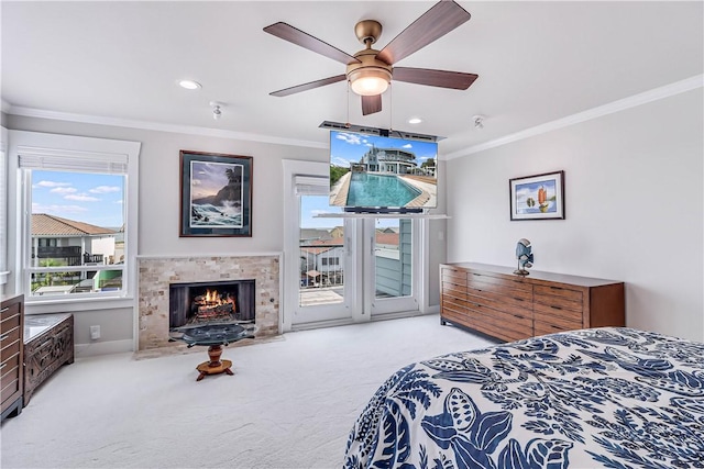 carpeted bedroom featuring access to exterior, ceiling fan, and ornamental molding