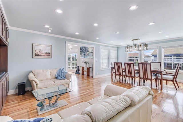 living room featuring light hardwood / wood-style floors and ornamental molding