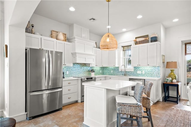 kitchen with plenty of natural light, visible vents, appliances with stainless steel finishes, and a sink