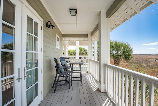 deck featuring french doors and a porch