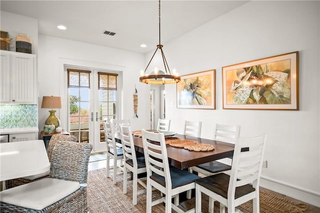 dining room with visible vents, a notable chandelier, recessed lighting, french doors, and baseboards