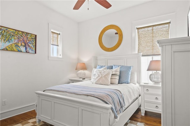 bedroom featuring dark wood-style flooring and ceiling fan