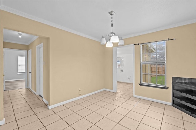 unfurnished dining area with light tile patterned floors, baseboards, a notable chandelier, and crown molding