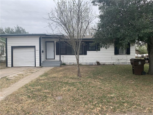 ranch-style house featuring a garage and a front lawn