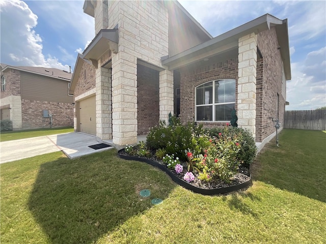 view of side of property with a garage and a lawn