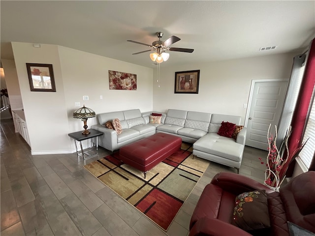 living room with hardwood / wood-style flooring and ceiling fan