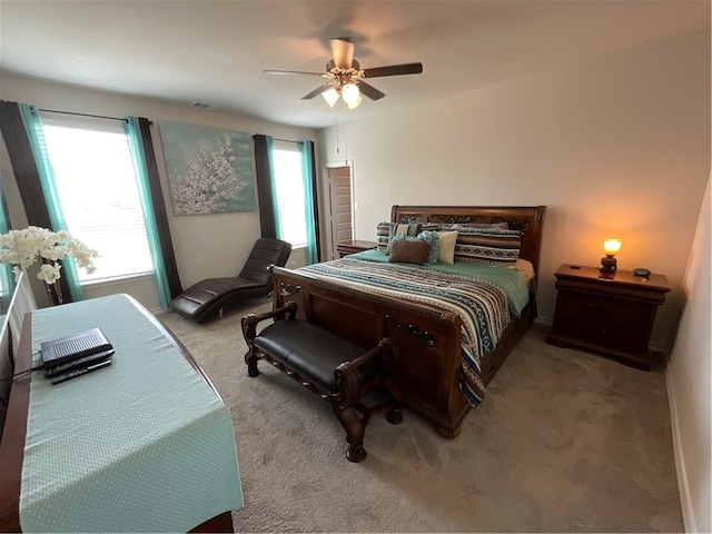 bedroom with light carpet and ceiling fan