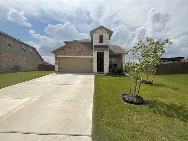 view of front of house featuring a garage, cooling unit, and a front yard