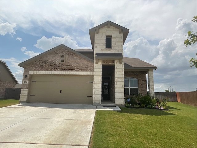 view of front of home with a front lawn and a garage