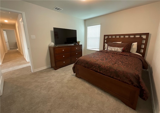 bedroom featuring light colored carpet