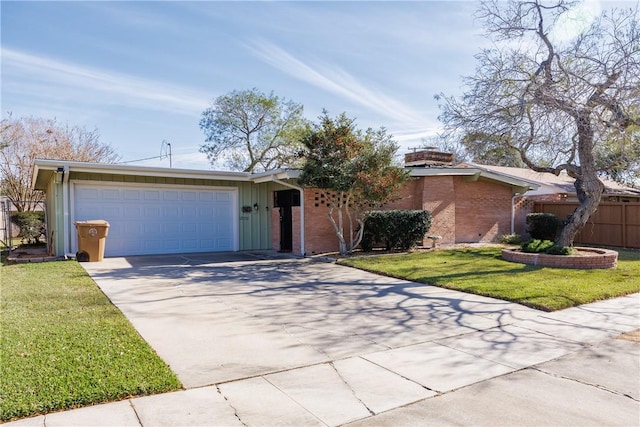 ranch-style home featuring a front lawn and a garage