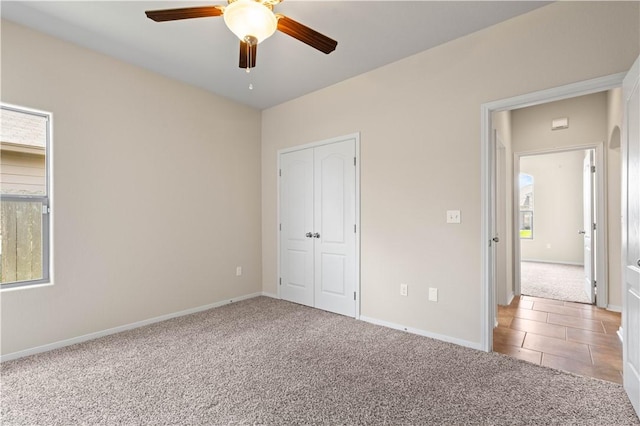 1733 Rhumba Trl, Corpus Christi, TX 78410 - unfurnished bedroom with light colored carpet, baseboards, a closet, and ceiling fan