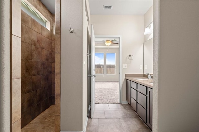 1733 Rhumba Trl, Corpus Christi, TX 78410 - full bath with a ceiling fan, tile patterned floors, vanity, walk in shower, and baseboards