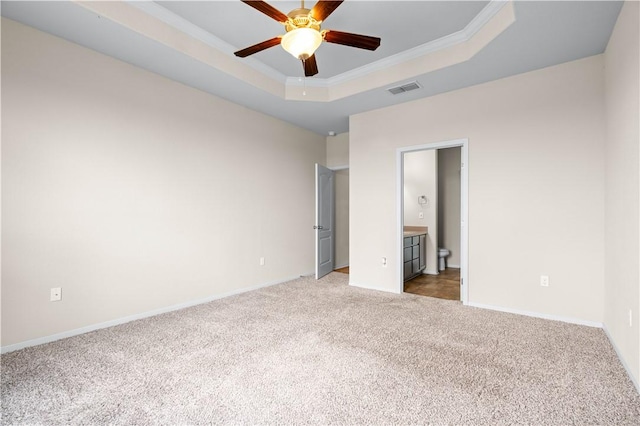 1733 Rhumba Trl, Corpus Christi, TX 78410 - unfurnished bedroom with carpet floors, baseboards, a tray ceiling, and crown molding