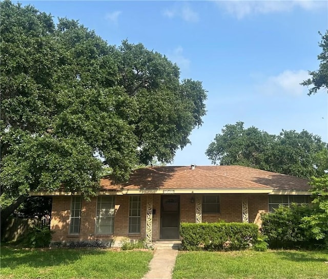 6026 Killarmet, Corpus Christi, TX 78413 - ranch-style house featuring a front yard and brick siding