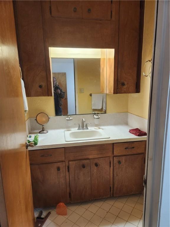 bathroom with tile patterned flooring and vanity