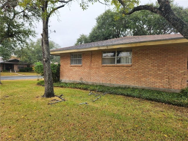 view of home's exterior with a lawn