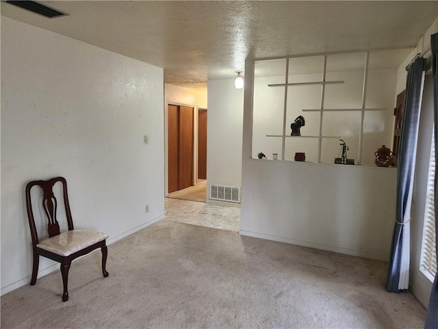 interior space featuring a textured ceiling