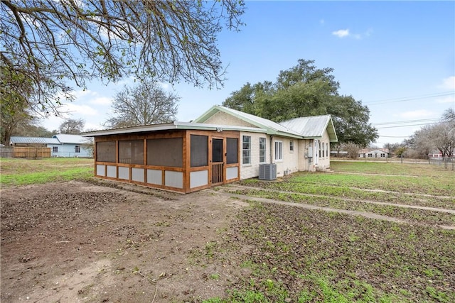 exterior space featuring a sunroom and central AC