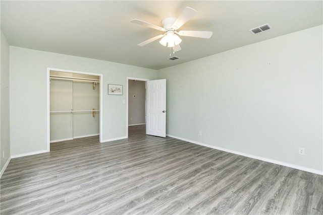 unfurnished bedroom with a closet, ceiling fan, and light hardwood / wood-style flooring