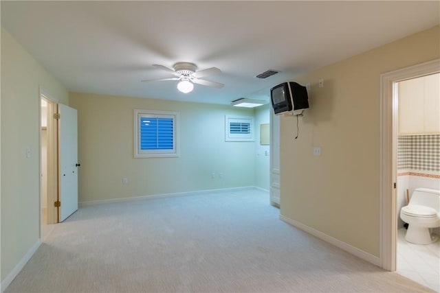 empty room with light colored carpet and ceiling fan