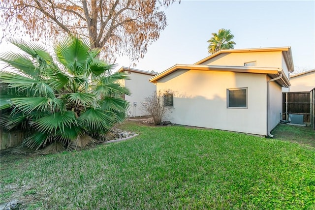 rear view of property with a yard