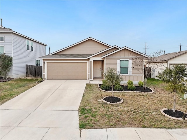 ranch-style house with a garage, driveway, fence, board and batten siding, and a front yard