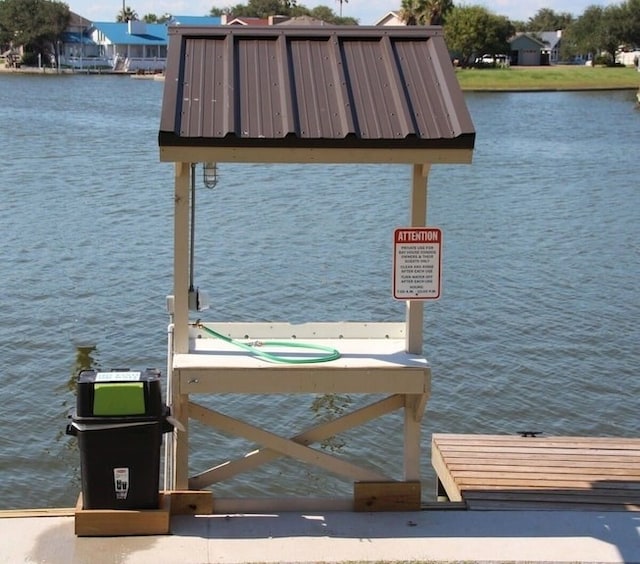 dock area featuring a water view