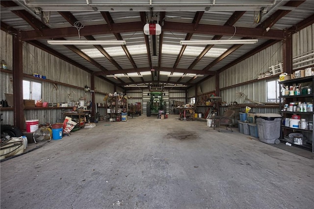 garage featuring a workshop area and a garage door opener