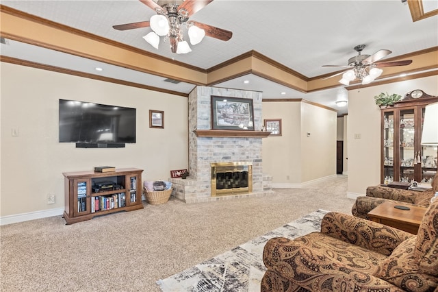 carpeted living room with a fireplace, ceiling fan, and crown molding