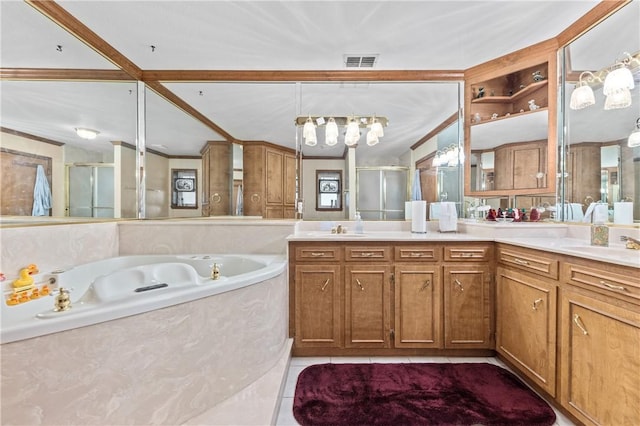 bathroom featuring tile patterned floors, vanity, ornamental molding, and shower with separate bathtub