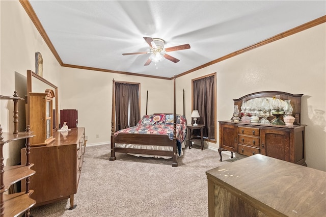 carpeted bedroom featuring ceiling fan and crown molding