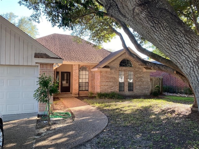 ranch-style home featuring a garage