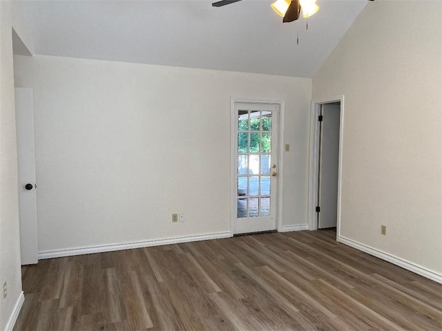 spare room with ceiling fan, lofted ceiling, and dark hardwood / wood-style floors