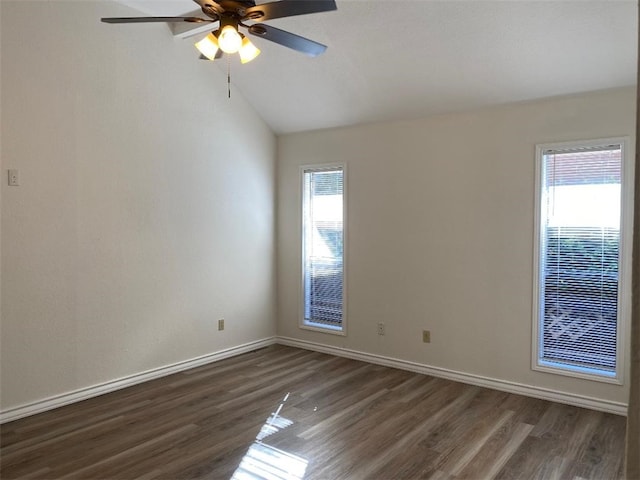 unfurnished room with ceiling fan, lofted ceiling, a healthy amount of sunlight, and dark hardwood / wood-style floors