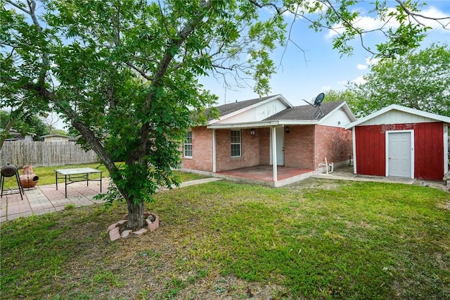 126 Cactus St, Robstown, TX 78380 - rear view of house featuring a patio and brick siding