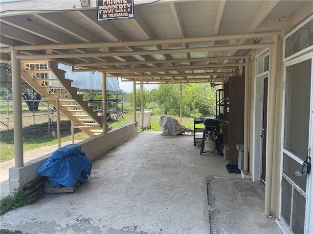 view of patio with an outbuilding