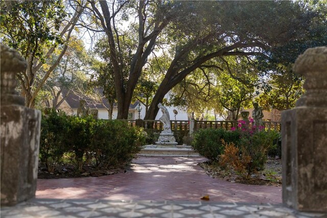 view of community with fence