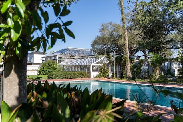 outdoor pool with glass enclosure