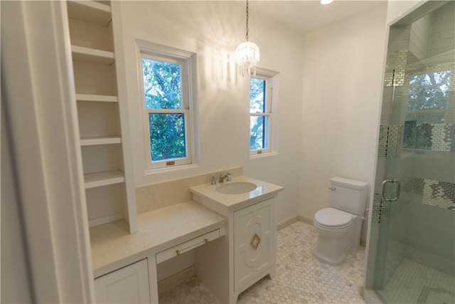 bathroom featuring vanity, toilet, tile patterned flooring, a shower stall, and a notable chandelier