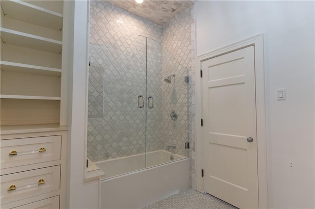 bathroom with shower / bath combination with glass door