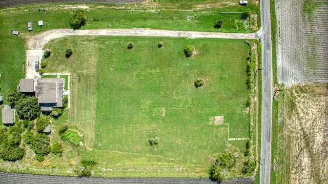 birds eye view of property featuring a rural view