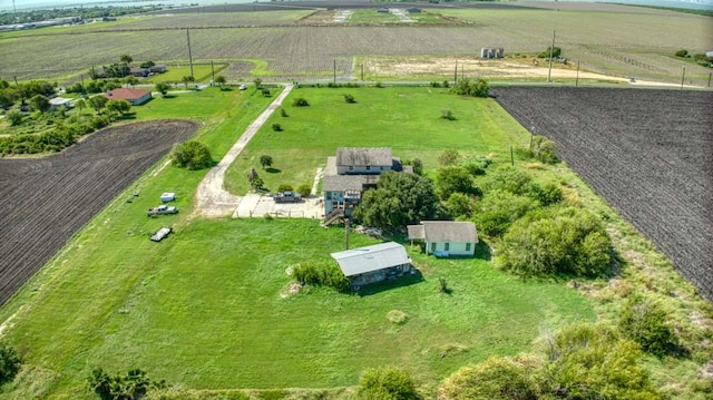 birds eye view of property with a rural view