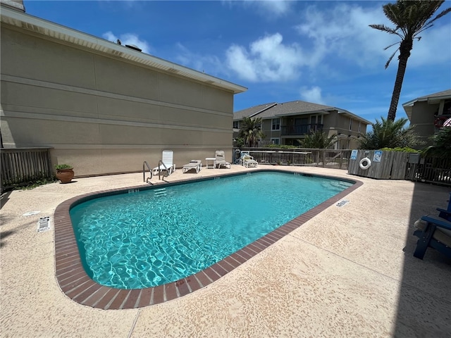 view of swimming pool featuring a patio area