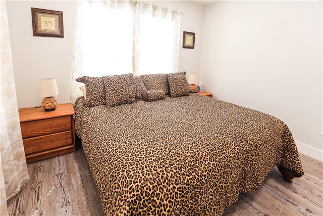 bedroom featuring wood-type flooring